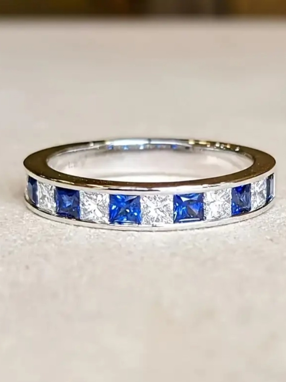 White Rhodium Sappire Blue Tourmaline Channel Set Eternity Band